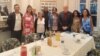 Los representantes estadounidenses Mark Pocan, James McGovern y Troy Carter junto a algunas madres de presos políticos del 11J.
