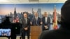 El senador Rick Scott (en el podio) junto a los congresistas Mario Díaz-Balart (derecha) y Carlos A. Giménez (izquierda) en el Aeropuerto Internacional de Miami, el 24 de mayo de 2024. (OCB Image).