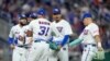 El lanzador puertorriqueño José De León, segundo desde la derecha, es felicitado por sus compañeros al final de la sexta entrada del juego del Clásico Mundial de Béisbol contra Israel.