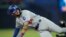 El jardinero derecho de Los Angeles Dodgers Andy Pages (84) etiquetado por el tercera base de Toronto Blue Jays Isiah Kiner-Falefa (7) tratando de robar la tercera base en el Rogers Centre. (John E. Sokolowski-USA TODAY Sports)
