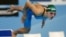 La lituana Ruta Meilutyte se lanza al agua para nadar la final de los 100m braza femenina de los Campeonatos del Mundo de Natación que se ha celebrado en la piscina del Palau Sant Jordi de Barcelona en la que ha conseguido la medalla de oro.