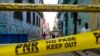 Una cinta amarilla de la policía prohíbe el paso a un barrio en cuarentena por COVID-19 en La Habana. (Yamil LAGE / AFP)