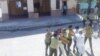 Micaela Roll Gibert (derecha) en una foto de archivo cuando era arrestada por mujeres policías frente a la sede de las Damas de blanco en La Habana. (Facebook).