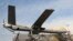 Un dron iraní Shahed-129, en un desfile militar en Teherán el 11 de febrero de 2016. (AP Photo/Ebrahim Noroozi, Archivo).
