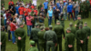 Díaz-Canel rodeado de militares en el Día de la Defensa.