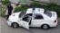 Una patrulla de la policía política en una calle de La Habana.