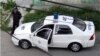 Una patrulla de la policía política en una calle de La Habana.