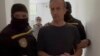 La fiscalía de Venezuela divulgó una fotografía en la que se ve al ex ministro de Petróleo, Tareck El Aissami, en el momento en que fue arrestado